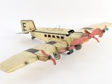 a toy airplane that is sitting on a white surface