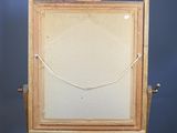 a picture of an easel with a picture hanging on it