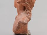a close up of a statue of a woman with long hair