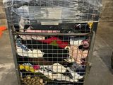 a metal cart with a bunch of shoes in it