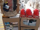a cart full of items in a warehouse filled with boxes