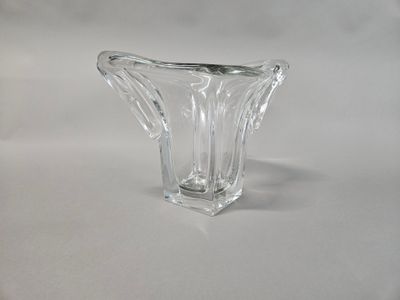a glass vase that is sitting on a table