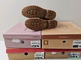 a pair of shoes that are on top of a box