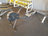 a row of exercise equipment in a gym room