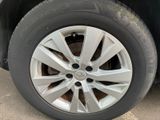 the tire of a car with a flat tire is shown