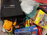 a plastic container filled with toys and a computer