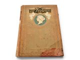 an old book with a picture of a woman on it