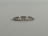 a close up of a diamond ring on a table