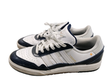 a pair of white and blue sneakers on a white background