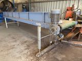 a close up of a conveyor belt in a warehouse