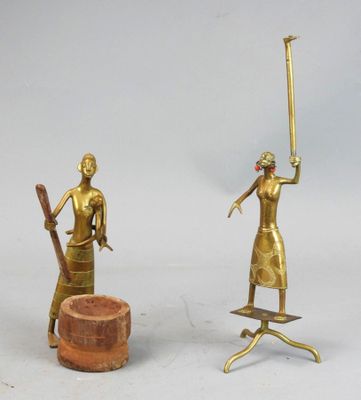 two figurines of a woman with a sword and a man with a hat