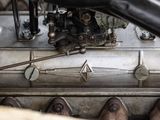 a close up view of a car engine with nozzles on it