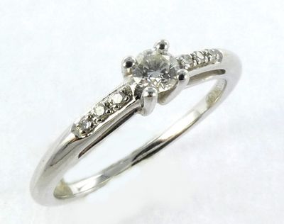 a picture of a diamond ring on a white background