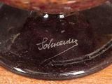a close up of a bowl on a wooden table