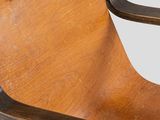 an image of a wooden chair with a metal arm rest