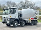 a cement truck that is parked in a parking lot