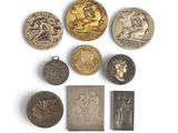 an image of a collection of medals and medals on a white surface