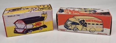 two boxes of toy cars sitting next to each other on a table