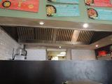 menus on the wall above the counter of a restaurant