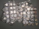 a lot of coins in the bag on the table