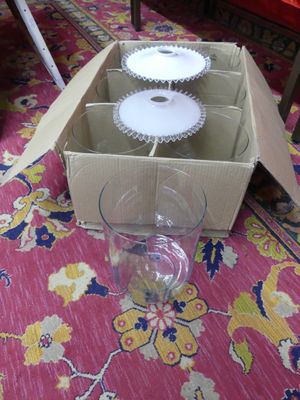 a box with a cupcake inside of it on the floor