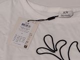 a white t - shirt with a black design on it