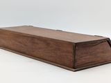 an old wooden box with a lid on a white background
