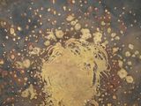 a close up picture of a decorative plate on a table
