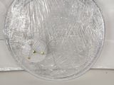 a picture of a white toilet with a plastic cover on it