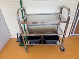 a stainless steel cart with two trays on it