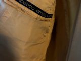 the back of a white jacket with a black label on it