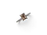 a close up of a ring on a white surface