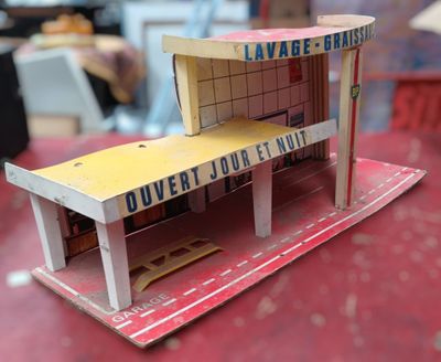 a small model of a building made out of cardboard