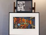 a picture of a picture of a man in a hat on top of a table