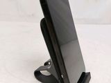 a cell phone that is sitting on a stand