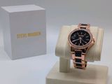a close up of a watch on a display with a box in the background