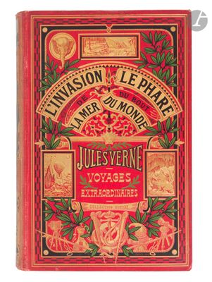 an old book with a red cover and gold lettering on it