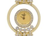 a close up of a watch with a bow on the face