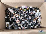 a cardboard box filled with bottles of alcohol