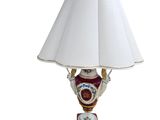 a lamp that is sitting on a table with a white shade