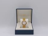 a close up of a watch in a box on a white surface
