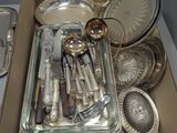 a box full of silverware on a table