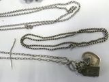 a silver chain with a lock on it on a table