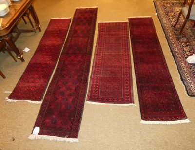 several rugs laid out on the floor in a living room