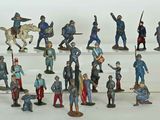 a lot of figurines that are on a shelf