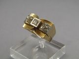 an image of a gold and diamond ring on a clear stand
