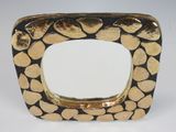 gold and black square shaped mirror with hearts on it