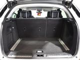 a trunk of a car with luggage in the back