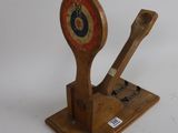 a wooden spoon and a wooden spoon rest on a stand