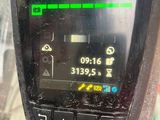 a close up of a cell phone on a pole